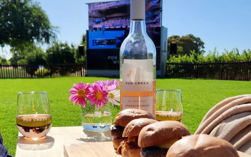 A bottle of wine and some sliders at the VIP Experience at Fox Creek Wines