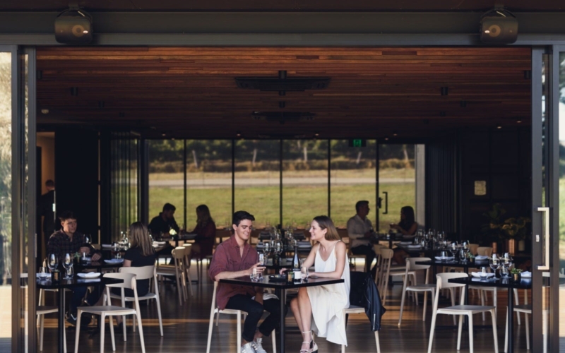 Two people eating at Little Wolf Restaurant at Mitolo Wines