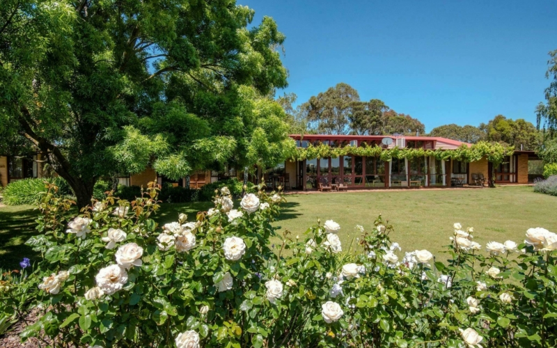 View of the Lodge from the lawned rose garden