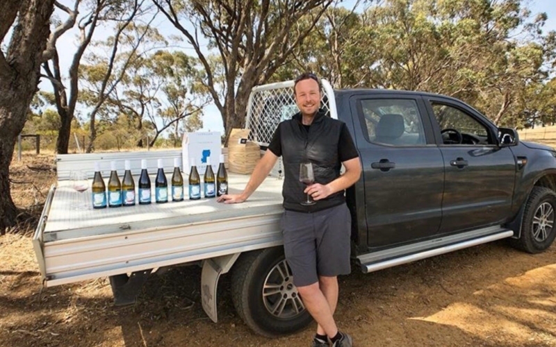 Winemaker Rob Mack with Aphelion wines on the tray of a ute